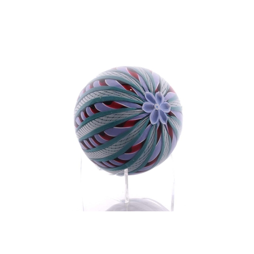 49 - Perthshire Paperweights; a collection of four weights comprising two with complex milifiori designs ... 
