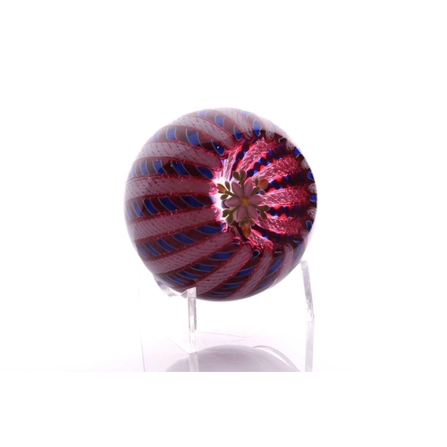 49 - Perthshire Paperweights; a collection of four weights comprising two with complex milifiori designs ... 