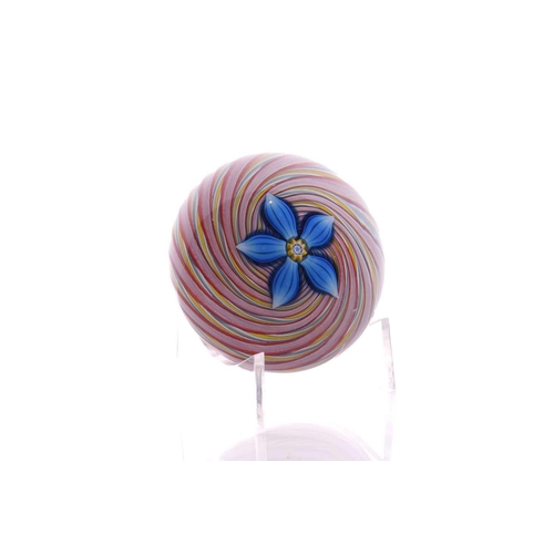 57 - Peter McDougall; two paperweights one having large central flower design with swirling ground and po... 