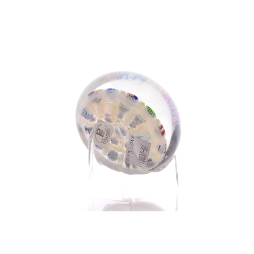 58 - Peter McDougall; a paperweight having millefiori design with latticino ground, having pollished base... 