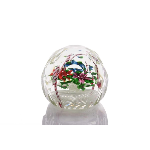 60 - John Deacons; an impressive faceted paperweight having large floral basket design internally, having... 