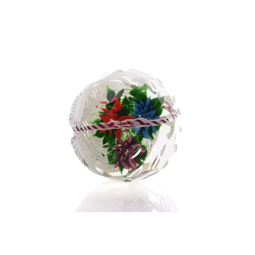 60 - John Deacons; an impressive faceted paperweight having large floral basket design internally, having... 