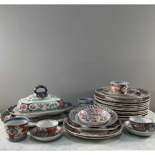 1226 - An Indian Ironstone tureen and cover with serving plate, 37.5 cm wide, in green and red, eight match... 