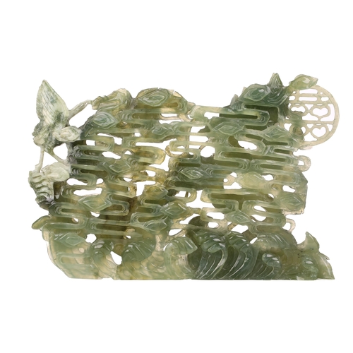 1235 - A contemporary Chinese variegated celadon jade carved and pierced study of two writhing dragons cont... 