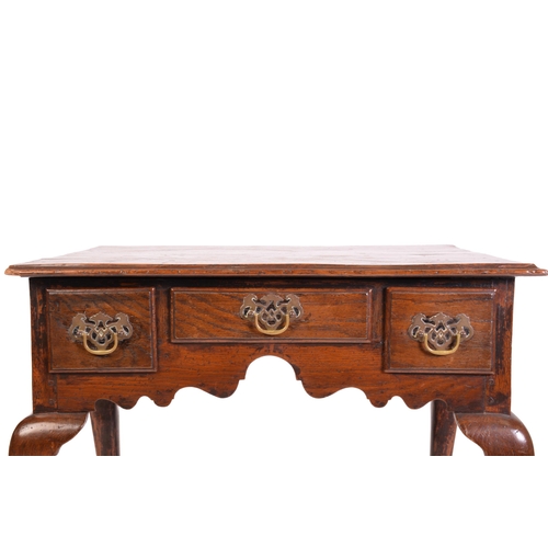 1241 - A George III and later oak kneehole lowboy with three short drawers and cabriole legs fore and aft. ... 