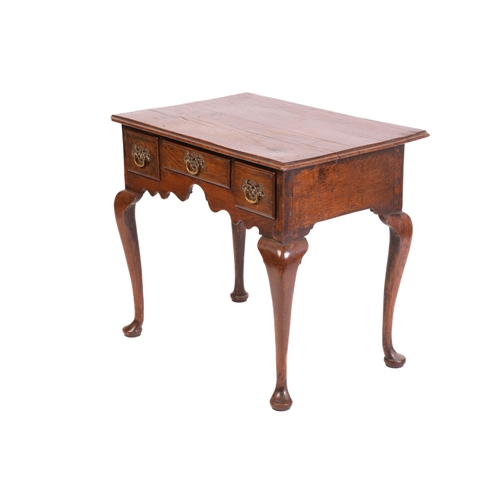 1241 - A George III and later oak kneehole lowboy with three short drawers and cabriole legs fore and aft. ... 