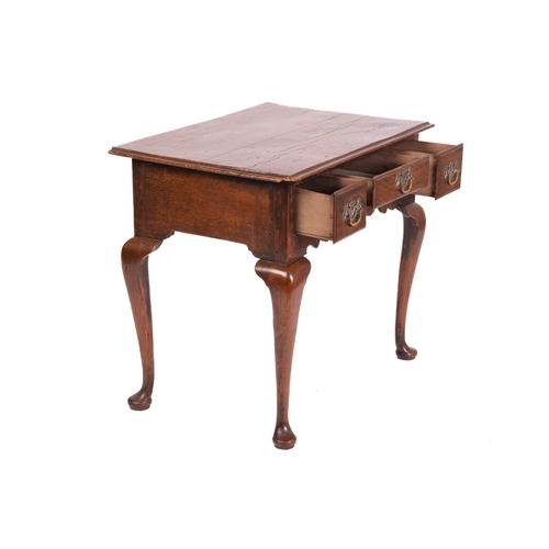 1241 - A George III and later oak kneehole lowboy with three short drawers and cabriole legs fore and aft. ... 