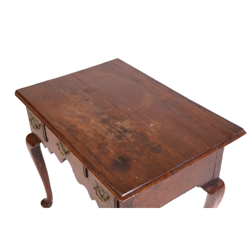 1241 - A George III and later oak kneehole lowboy with three short drawers and cabriole legs fore and aft. ... 