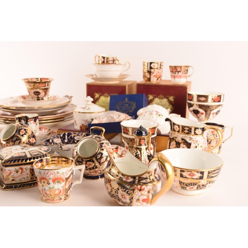 1263 - A large collection of Royal Crown Derby Imari pattern wares, comprising cups, saucers plates, a lidd... 