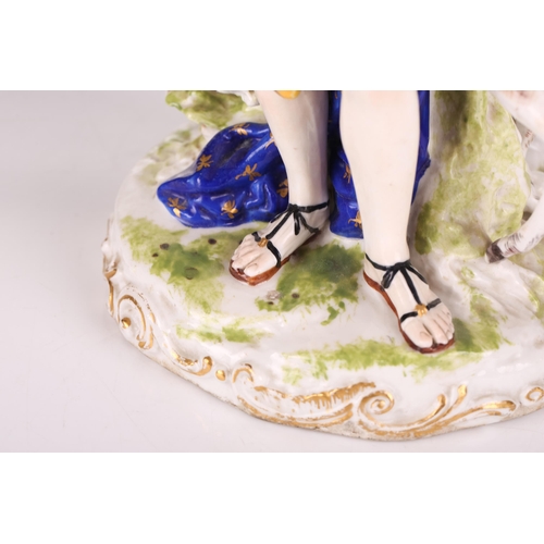 1266 - An 18th-century Derby porcelain figure of a triumphant Diana the huntress accompanied by an attentiv... 