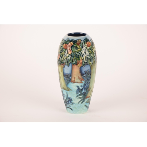 1274 - Three Moorcroft vases, one having peacock decoration, one floral on green ground and the largest hav... 