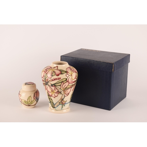 1278 - A Moorcroft pink floral vase on a white ground, together with a small lidded ginger jar of the same ... 