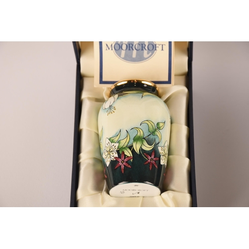 1280 - A collection of four miniature Moorcroft vases (two boxed)