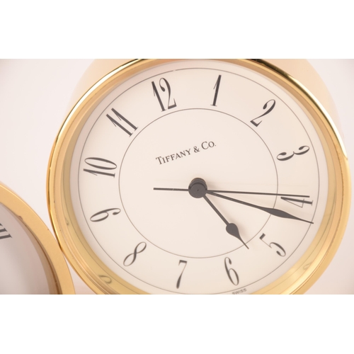 1244 - Tiffany & Co; two desk clocks both signed to dial, having quartz movements. Good condition, the work... 