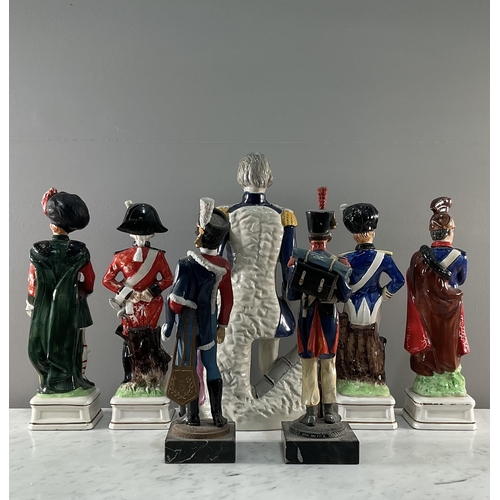 1289 - A collection of ceramic figures of soldiers of various nationality comprising four novelty decanters... 