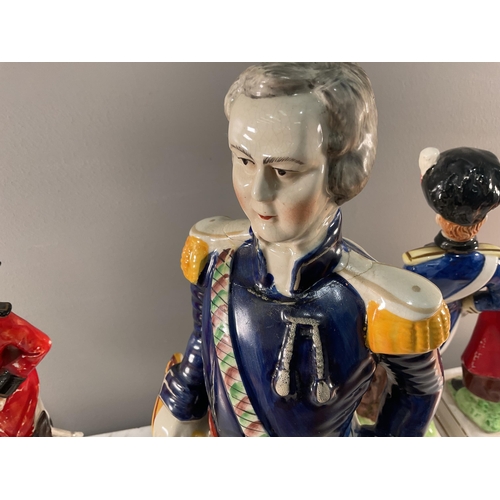 1289 - A collection of ceramic figures of soldiers of various nationality comprising four novelty decanters... 