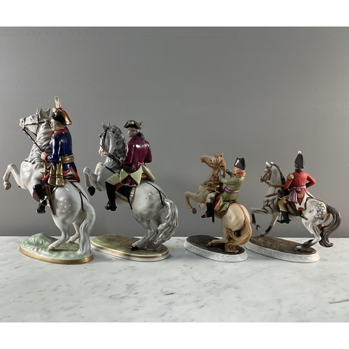 1290 - A collection of four continental porcelain figures of soldiers on horseback, two being Dresden and m... 