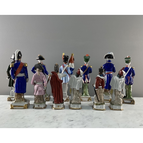 1292 - A collection of twelve continental porcelain figures of soldiers and military figures mostly by Dres... 