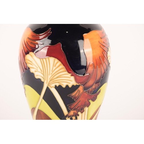 1296 - A Moorcroft vase having floral decoration on blue ground, signed to base Rachel Bishop, with box, 26... 