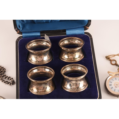 1333 - A selection of silver items including, a box of four napkin rings dated 1925, a further napkin ring ... 