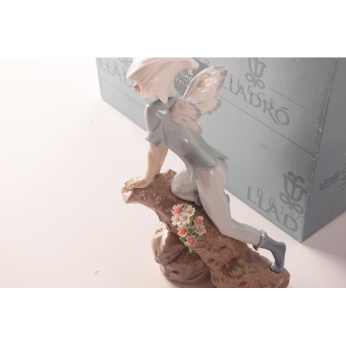 102 - A collection of two boxed Lladro figures, one of girl with flowers, signed to base with original pap... 