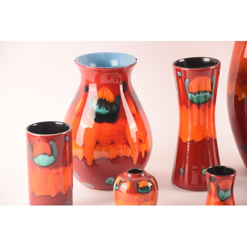 110 - Poole; a collection of ceramics comprising eight vases in the volcano pattern of varying size and sh... 