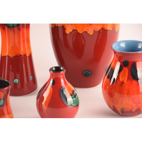 110 - Poole; a collection of ceramics comprising eight vases in the volcano pattern of varying size and sh... 