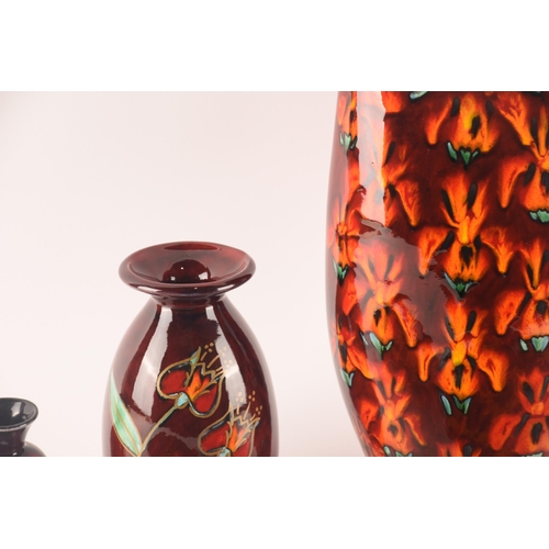 115 - Anita Harris; a collection of ceramics comprising three vases of varying sizes, shapes and patterns ... 