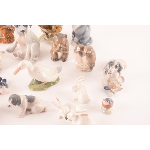 119 - A collection of seventeen Royal Copenhagen ceramic animals comprising various dogs, sheep, bears and... 