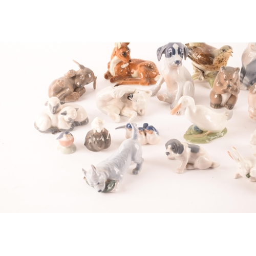 119 - A collection of seventeen Royal Copenhagen ceramic animals comprising various dogs, sheep, bears and... 