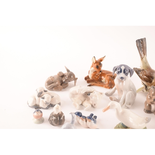 119 - A collection of seventeen Royal Copenhagen ceramic animals comprising various dogs, sheep, bears and... 