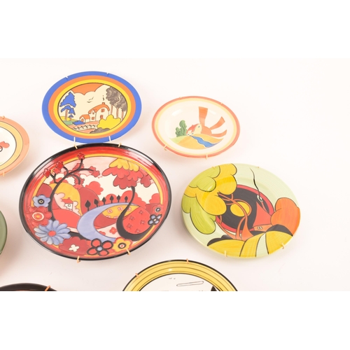 126 - After Clarice Cliff; a collection of various decorative plates by various makers comprising Vicary W... 