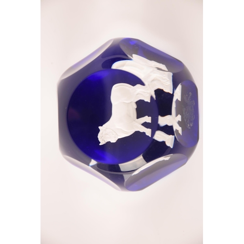 132 - Baccarat; a collection of four sulphide paperweights having centeral motifs on blue ground, external... 