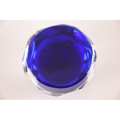 132 - Baccarat; a collection of four sulphide paperweights having centeral motifs on blue ground, external... 