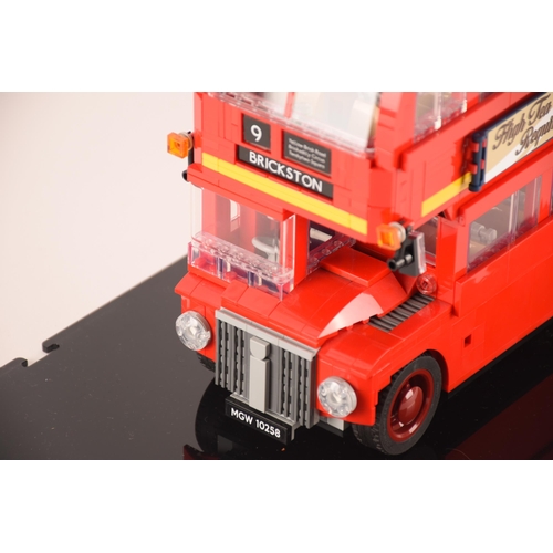 150 - A pre constructed Lego London bus together with a pre constructed Lego London skyline, both in custo... 