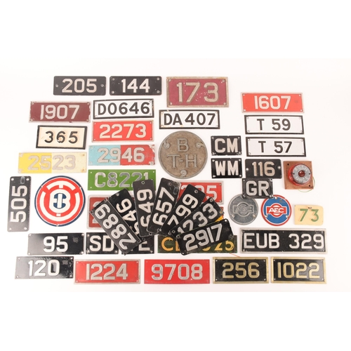 154 - A large collection of enamel bus plates. to include cab plates, fleet plates, radiator badges and ot... 