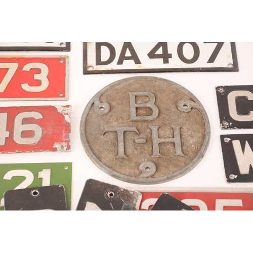 154 - A large collection of enamel bus plates. to include cab plates, fleet plates, radiator badges and ot... 