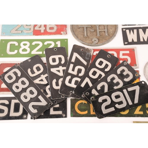 154 - A large collection of enamel bus plates. to include cab plates, fleet plates, radiator badges and ot... 