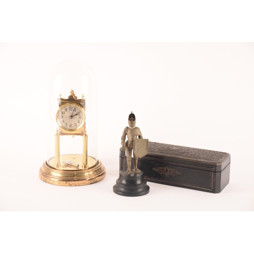 139 - A collection of items comprising a modern clock in dome, a novelty knight table lighter and a boulle... 