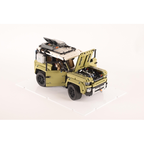 145 - A large and impressive Lego Land Rover Defender, having various moveable mechanics including model e... 