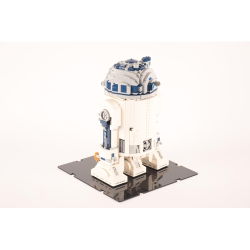 148 - A pre-constructed Lego Star Wars R2D2 in custom-built display cabinet, having various working mechan... 