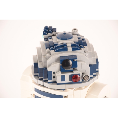 148 - A pre-constructed Lego Star Wars R2D2 in custom-built display cabinet, having various working mechan... 