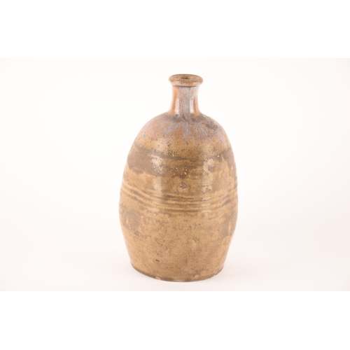 25 - A Japanese Meiji period sake bottle, embossed with figure, 26cm. Good commensurate with age.