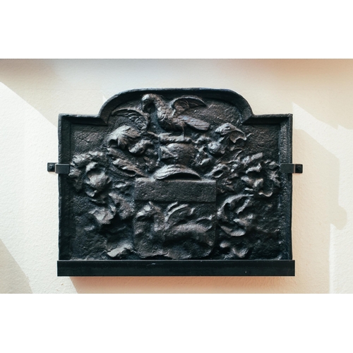 34 - A cast iron fireback, relief decorated with a bird amongst leaves, 59 cm high x 73 cm wide. Provenan... 