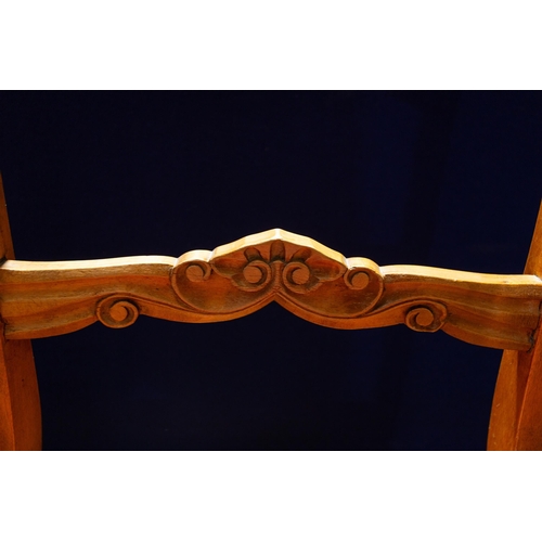 39 - A set of four continental Birchwood dining chairs. the shaped top rails over scroll carved mid-rails... 