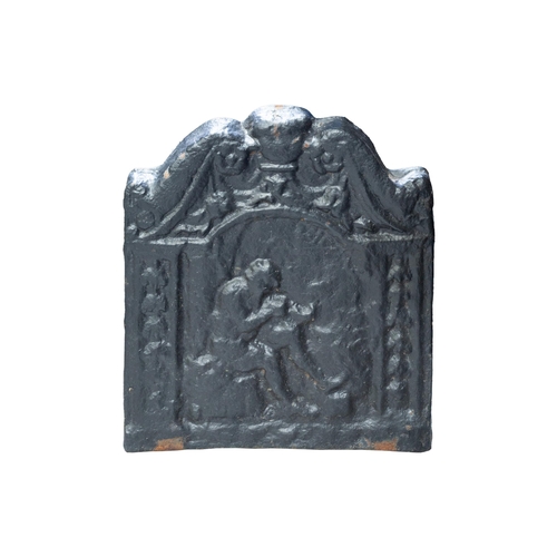 42 - A small cast iron fire back, possibly 18th century, the swan-neck top over a panel depicting a seate... 