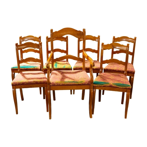 47 - A French fruitwood single carver chair, 104 cm high x 53 cm wide, together with six conforming dinin... 