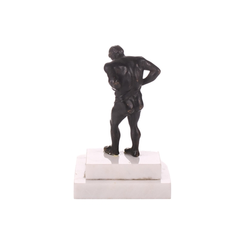 53 - A patinated bronze figure of Atlas, first half of the 19th century, on a later stepped marble base, ... 