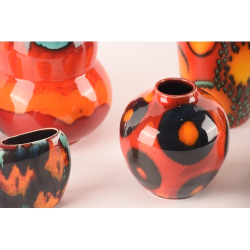 60 - Anita Harris and Poole; a collection of ceramics comprising six vases of varying sizes, shapes and p... 