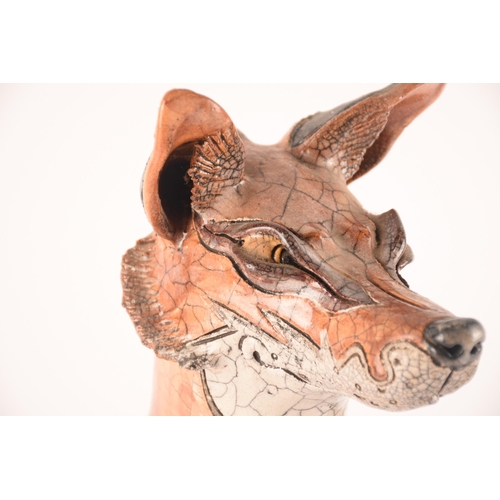 75 - Jennie Hale (20th century) British, a large crackle-glazed ceramic model of a tan and white fox, 43 ... 